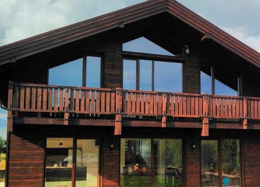 Casas de madera terminadas con OSMO: Máxima belleza y protección